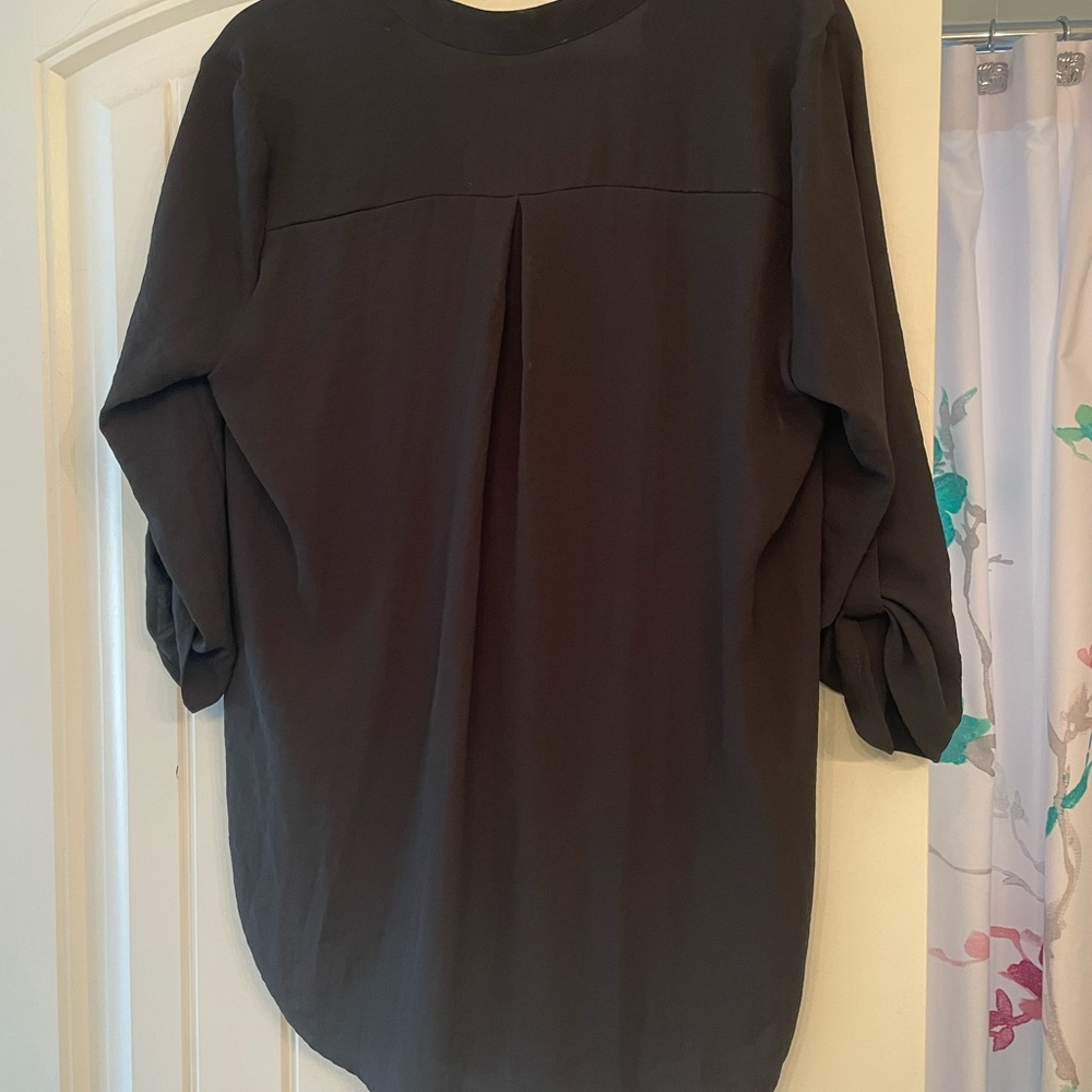 Woman’s black blouse by lush